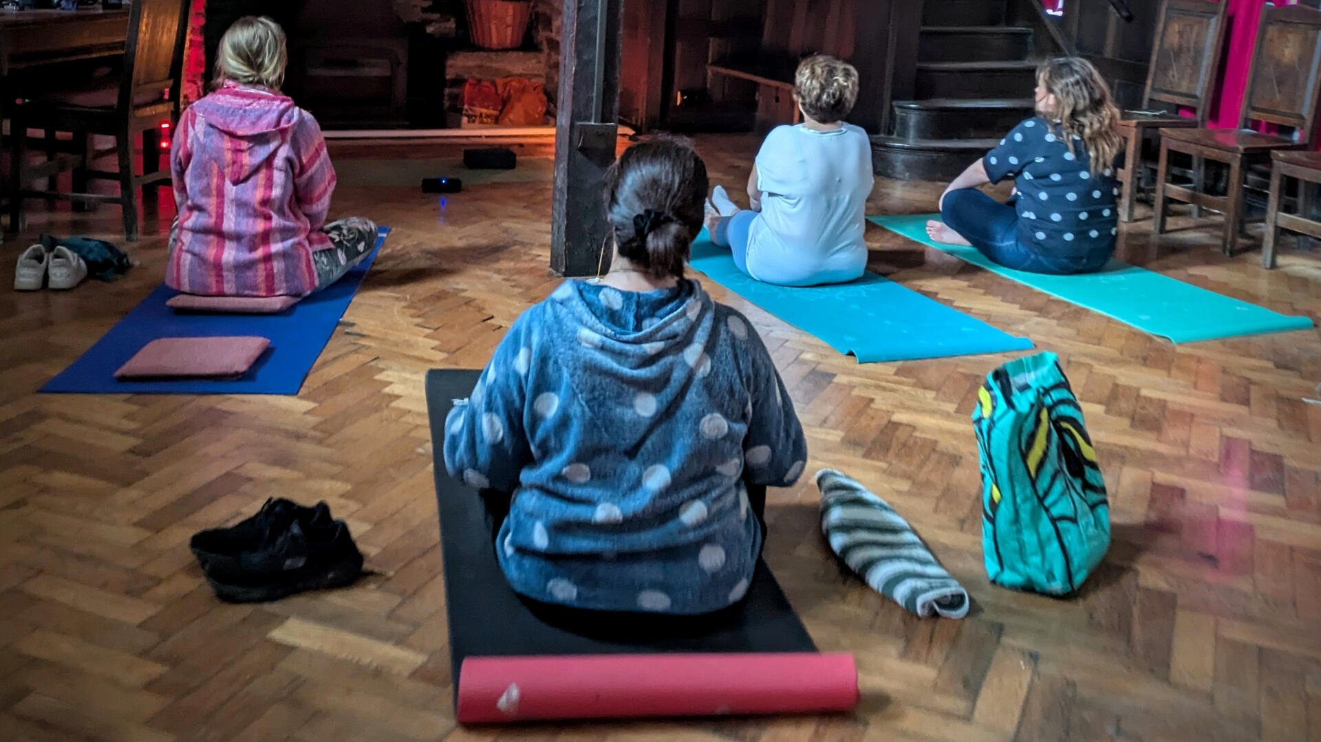 A women practicing Shavasana during a Yoga Nidra session